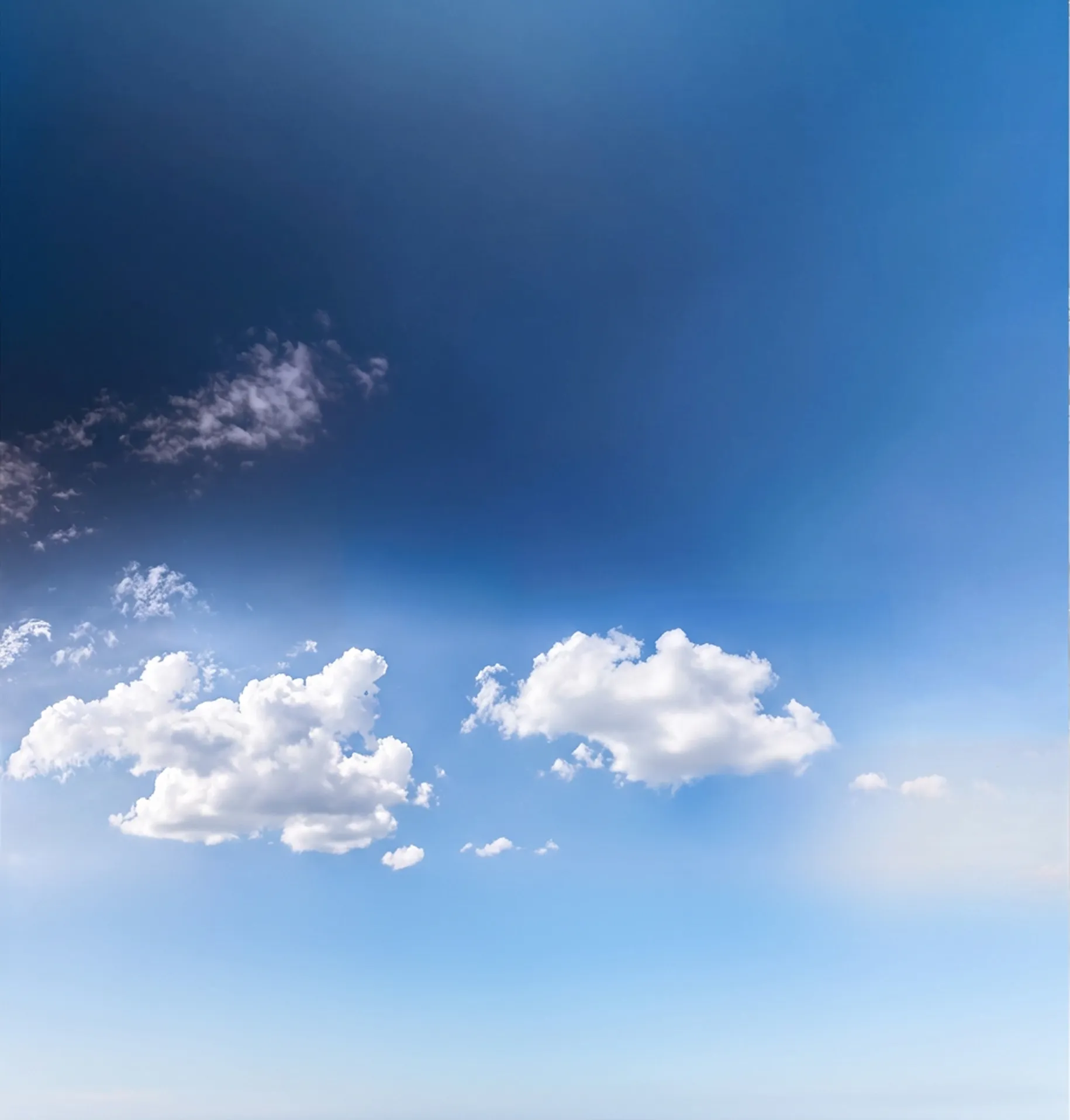 Light blue sky with clouds